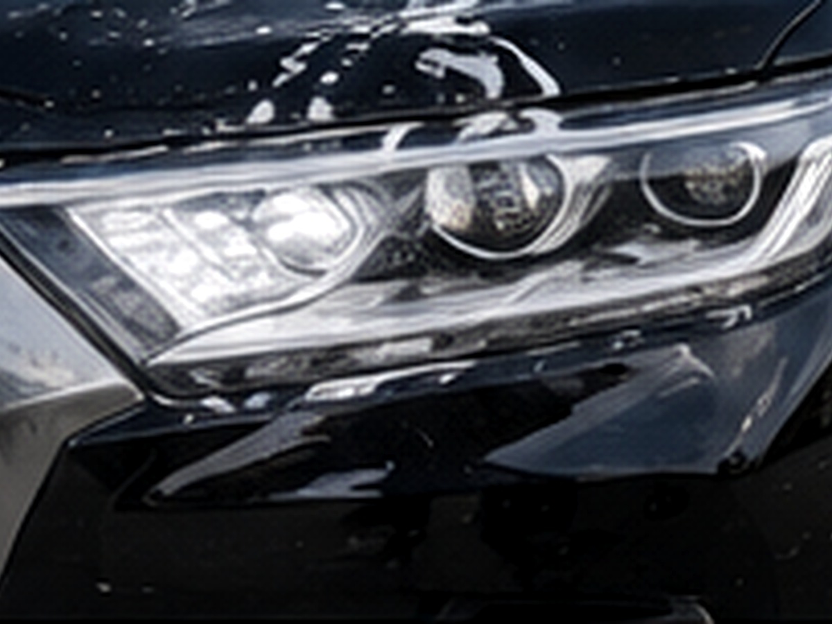 Glossy vehicle paint finish after detailing