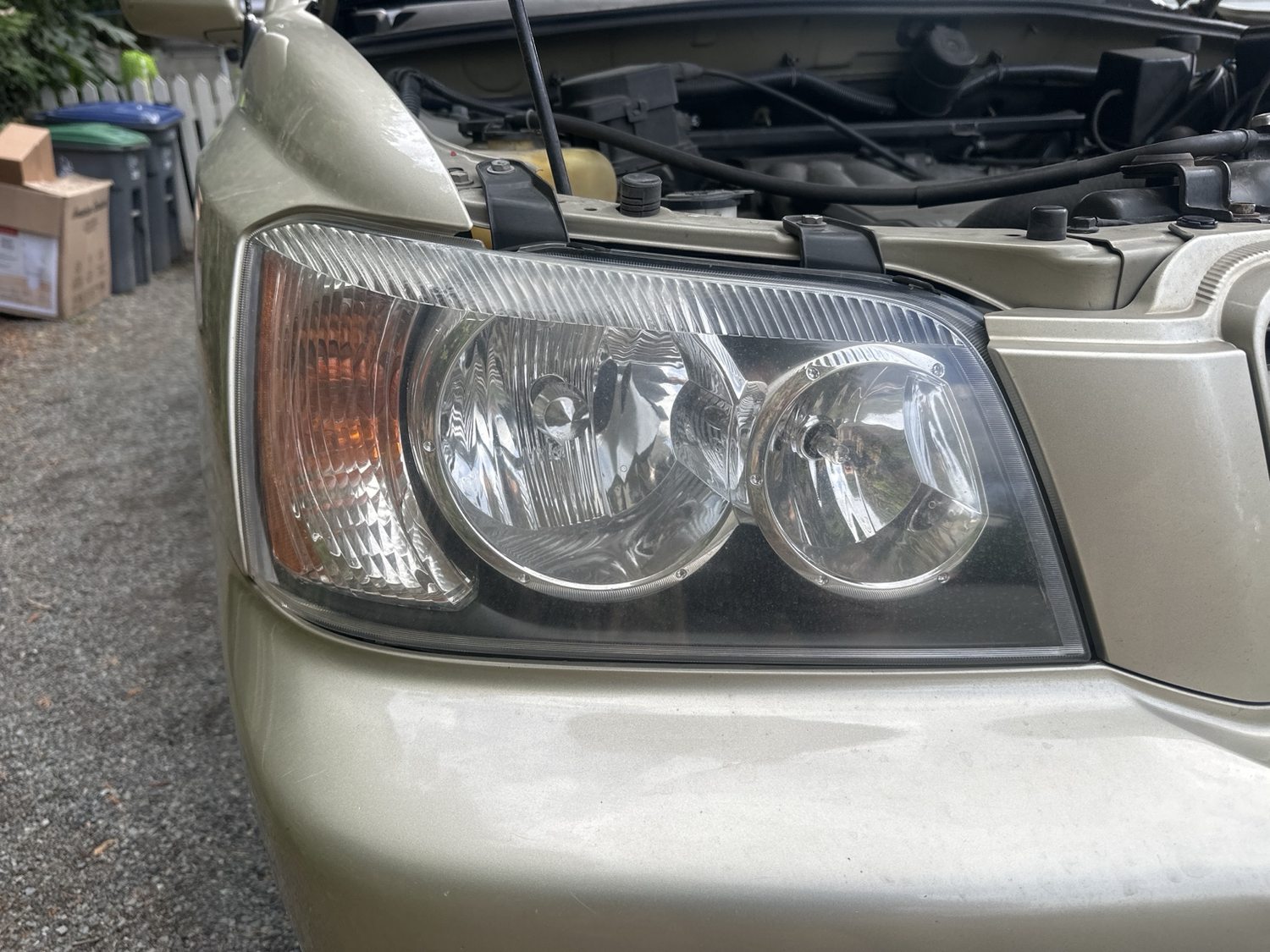 Left vehicle headlight before restoration, cloudy lens