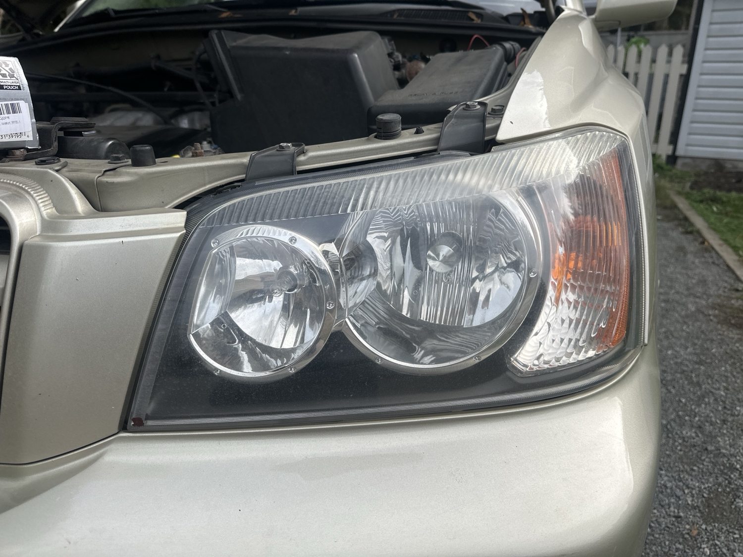 Right vehicle headlight before restoration, cloudy lens